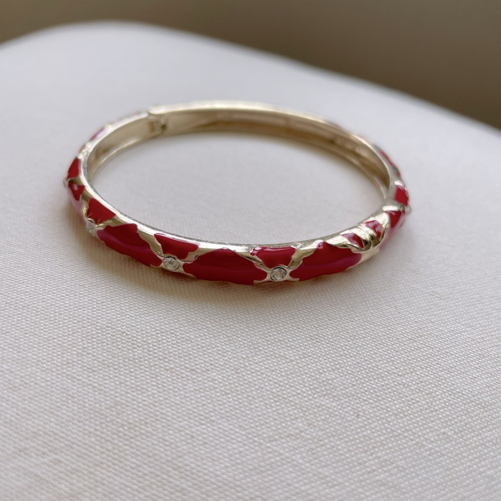 Red enamel bangle bracelet with gold and rhinestone detail